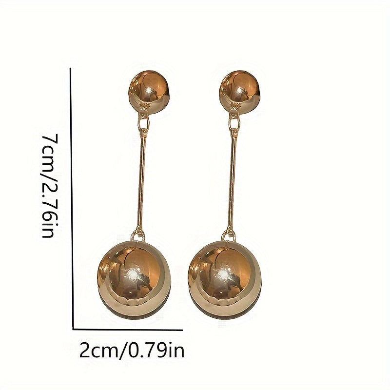 Elegant And Simple Golden Commuter Earrings With Round Tassels