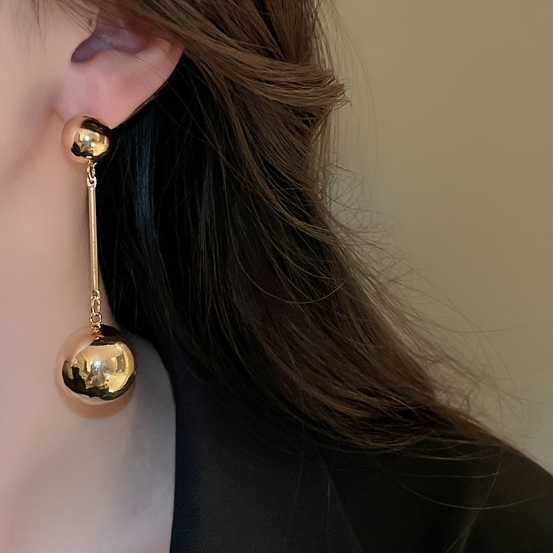 Elegant And Simple Golden Commuter Earrings With Round Tassels
