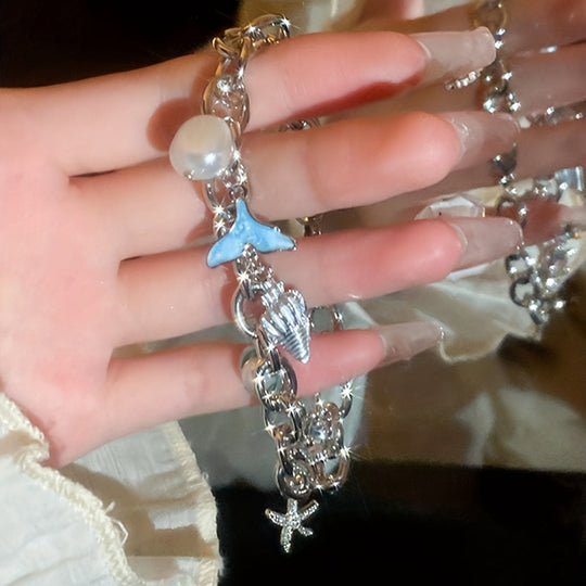 Elegant Ocean-Inspired Golden-Tone Charm Bracelet