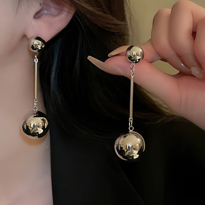 Elegant And Simple Golden Commuter Earrings With Round Tassels