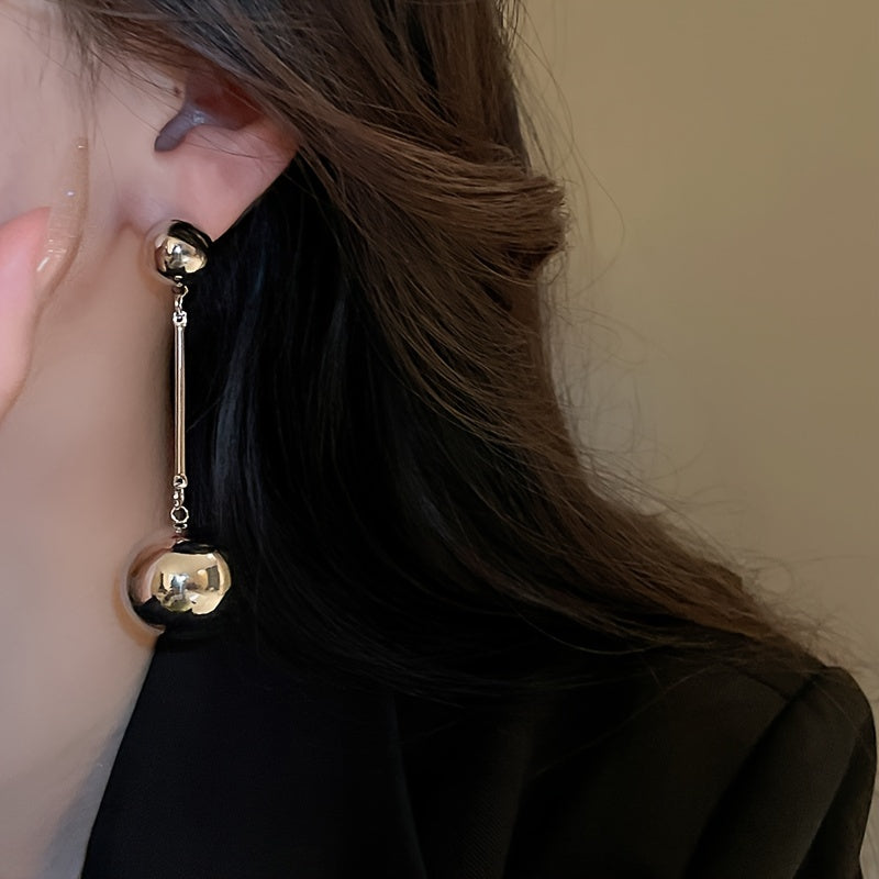 Elegant And Simple Golden Commuter Earrings With Round Tassels
