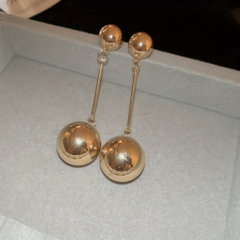 Elegant And Simple Golden Commuter Earrings With Round Tassels