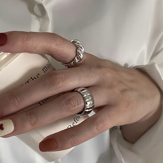 Two Simple Geometric Round Rings
