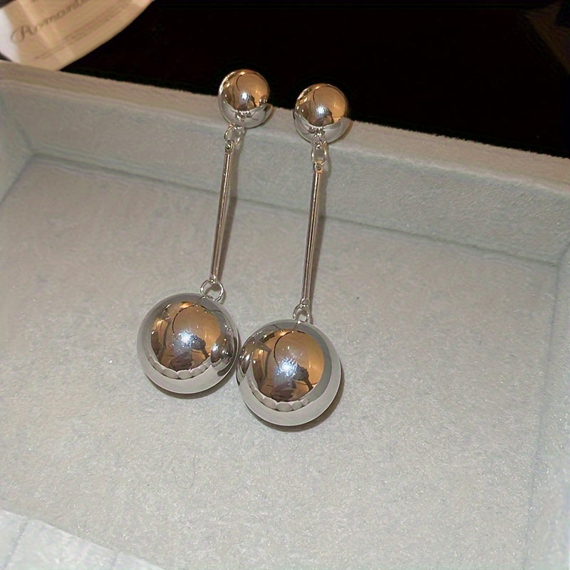 Elegant And Simple Golden Commuter Earrings With Round Tassels