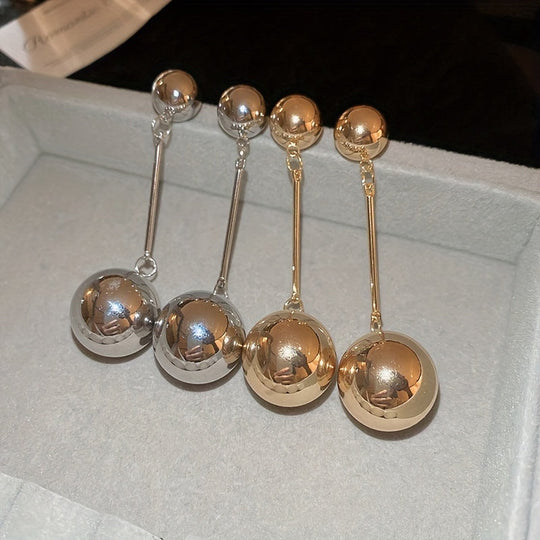 Elegant And Simple Golden Commuter Earrings With Round Tassels