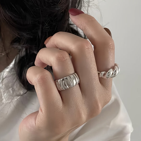 Two Simple Geometric Round Rings