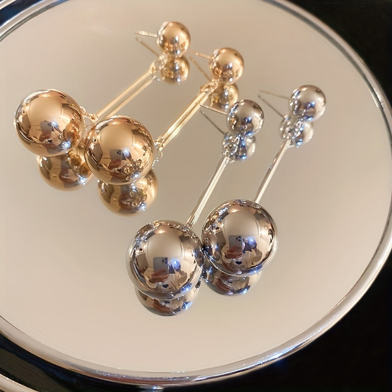 Elegant And Simple Golden Commuter Earrings With Round Tassels